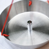 Close up of a weight on one side of the Glückskäfer balance with weights children's weighing scales toy.  