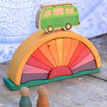 A Glückskäfer Yellow Sunray Arch in a simple small world play set up with Grapat Nins and a Lanka Kade camper van.