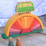 A Glückskäfer Yellow Sunray Arch in a simple small world play set up with Grapat Nins and a Lanka Kade camper van.