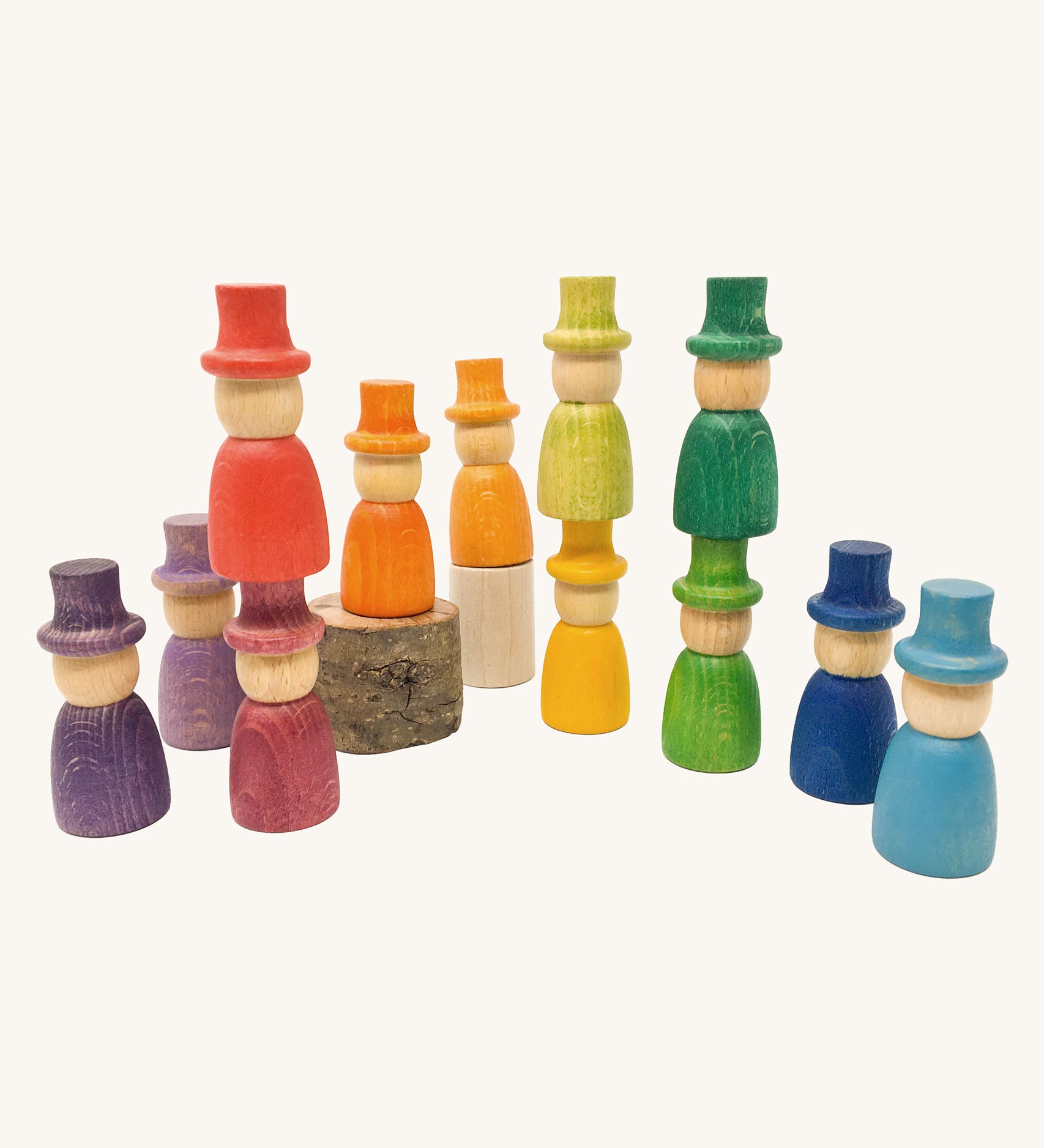 Grapat 12 Magos wooden peg dolls with top hats in a rainbow of 12 colours. These wooden toys are part of a wide range of open ended toys available at Babipur.  