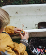 Close up of a child's holding a boat pot created using one of the gifts included in the Grapat 2026 advent calendar available at Babipur.