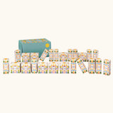 Grapat 2026 advent calendar available at Babipur. A large green box with 24 white patterned boxes filled with various wooden toys, craft kits and gifts. 