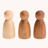 Grapat 3 Natural Nins. Three wooden peg dolls made from 3 different wood types. These wooden toys are part of a wide range of open ended toys available at Babipur.  