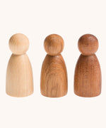 Grapat 3 Natural Nins. Three wooden peg dolls made from 3 different wood types. These wooden toys are part of a wide range of open ended toys available at Babipur.  