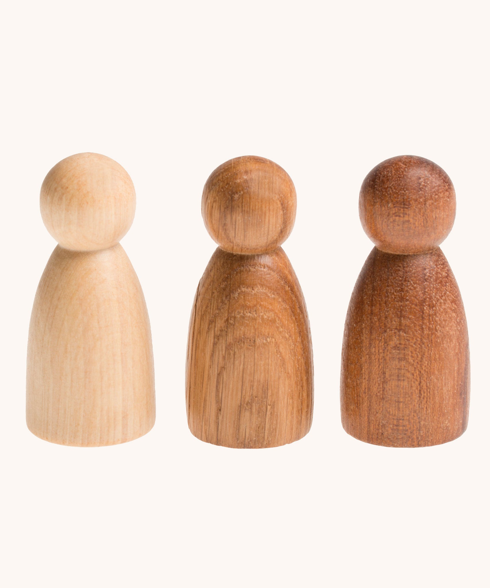 Grapat 3 Natural Nins. Three wooden peg dolls made from 3 different wood types. These wooden toys are part of a wide range of open ended toys available at Babipur.  