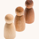 Grapat 3 Natural Nins. Three wooden peg dolls made from 3 different wood types. These wooden toys are part of a wide range of open ended toys available at Babipur.  