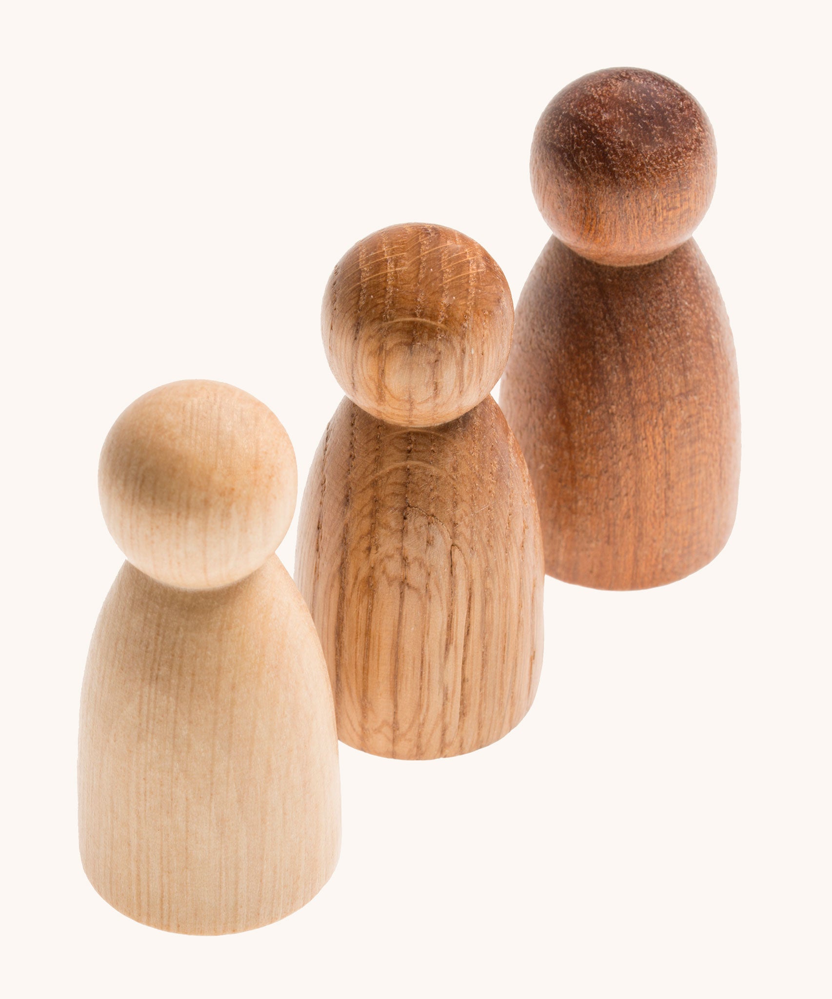 Grapat 3 Natural Nins. Three wooden peg dolls made from 3 different wood types. These wooden toys are part of a wide range of open ended toys available at Babipur.  