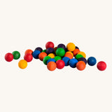 Grapat set of 36 wooden marbles in a mix of 6 rainbow colours, red, orange, yellow, green, blue and purple. Grapat have a range of wooden loose parts and toys available at Babipur.
