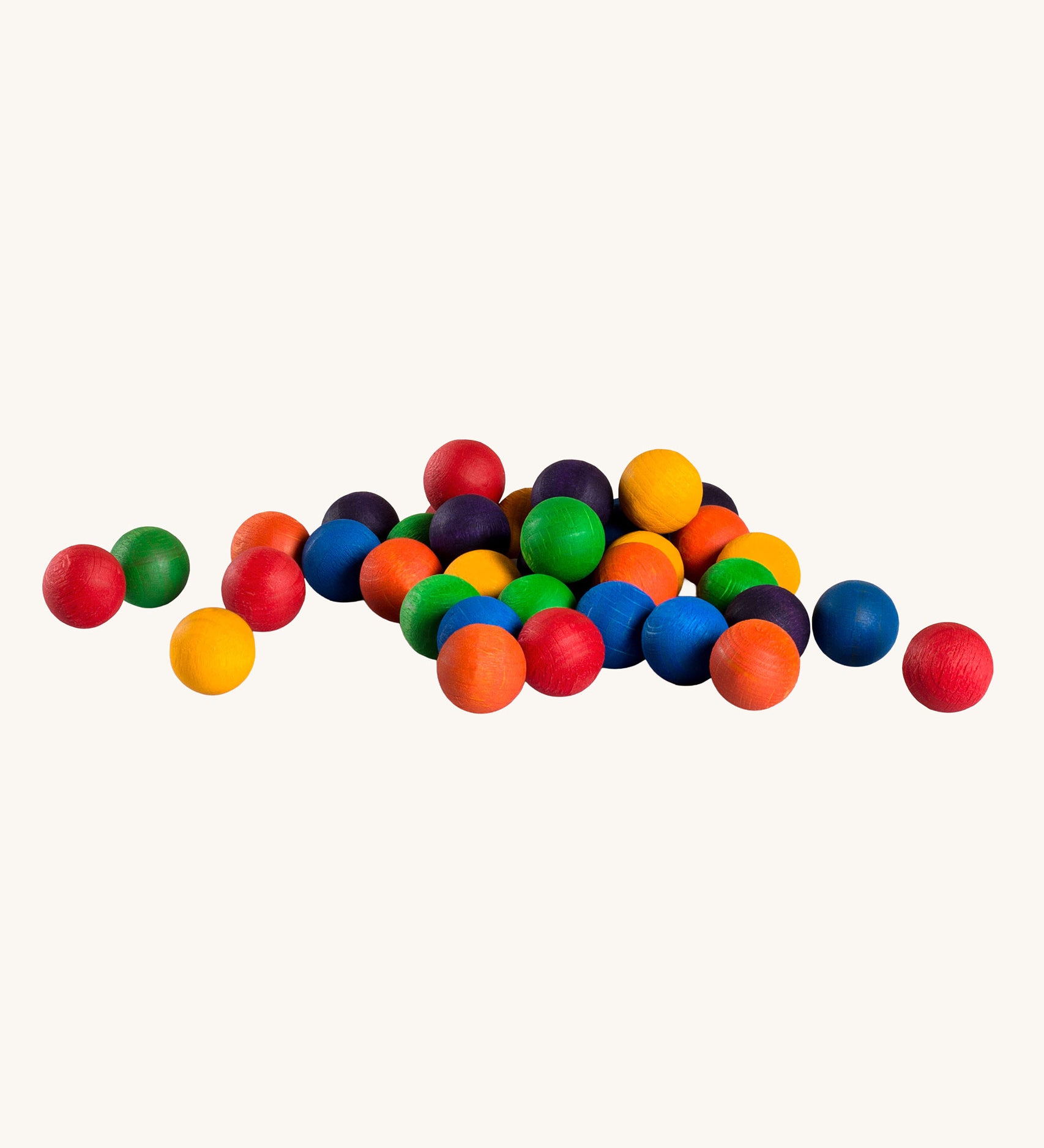 Grapat set of 36 wooden marbles in a mix of 6 rainbow colours, red, orange, yellow, green, blue and purple. Grapat have a range of wooden loose parts and toys available at Babipur.
