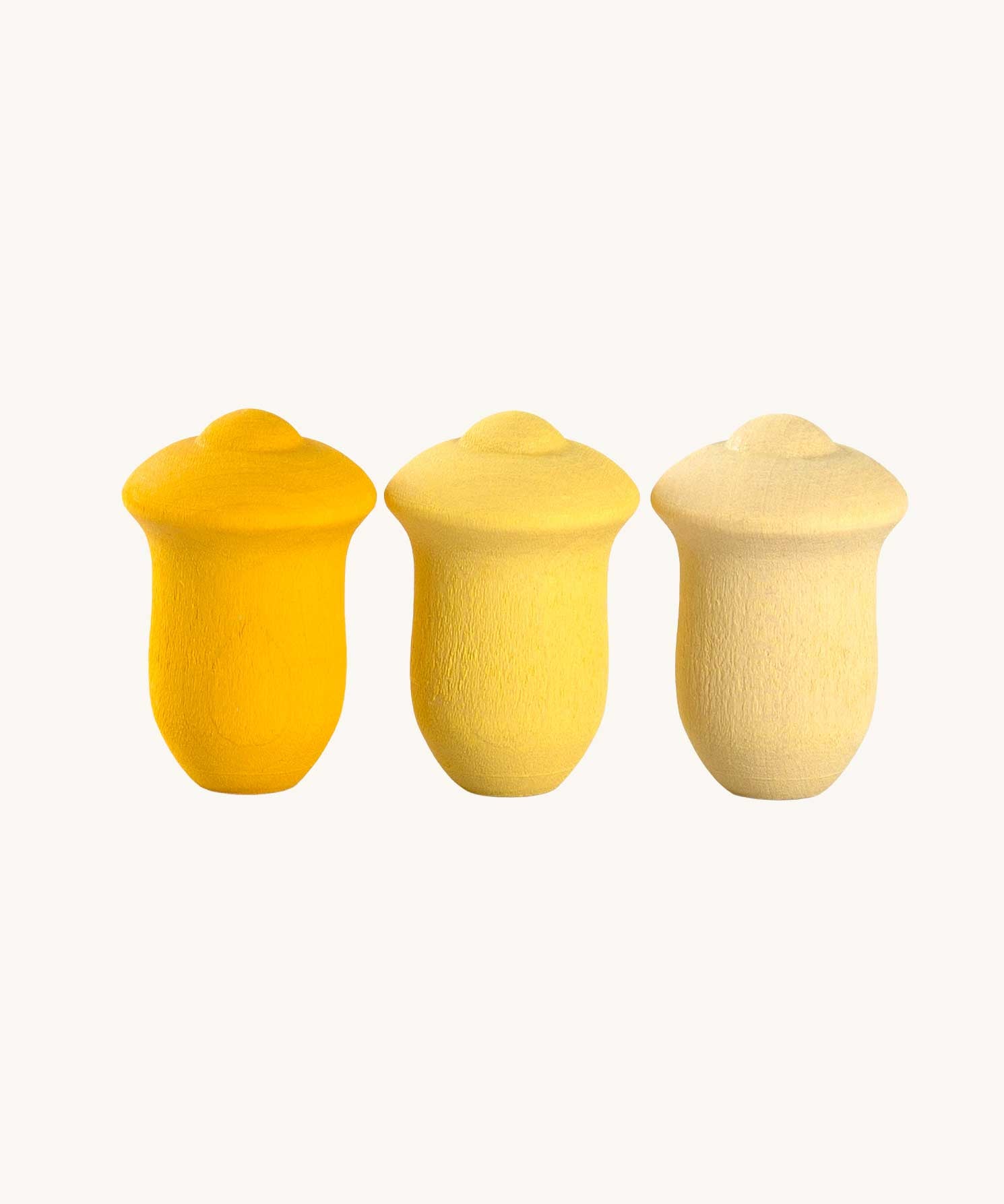 Grapat yellow wooden Mandala Tulips 36x Pieces. The tulip shapes come in 3 shades of yellow, 12 in each shade of yellow. These wooden loose part toys are part of a wide range of open ended toys available at Babipur. 