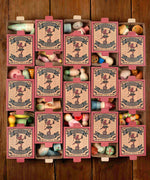 A flatlay showing all wooden sets inside the decorative cardboard packaging 