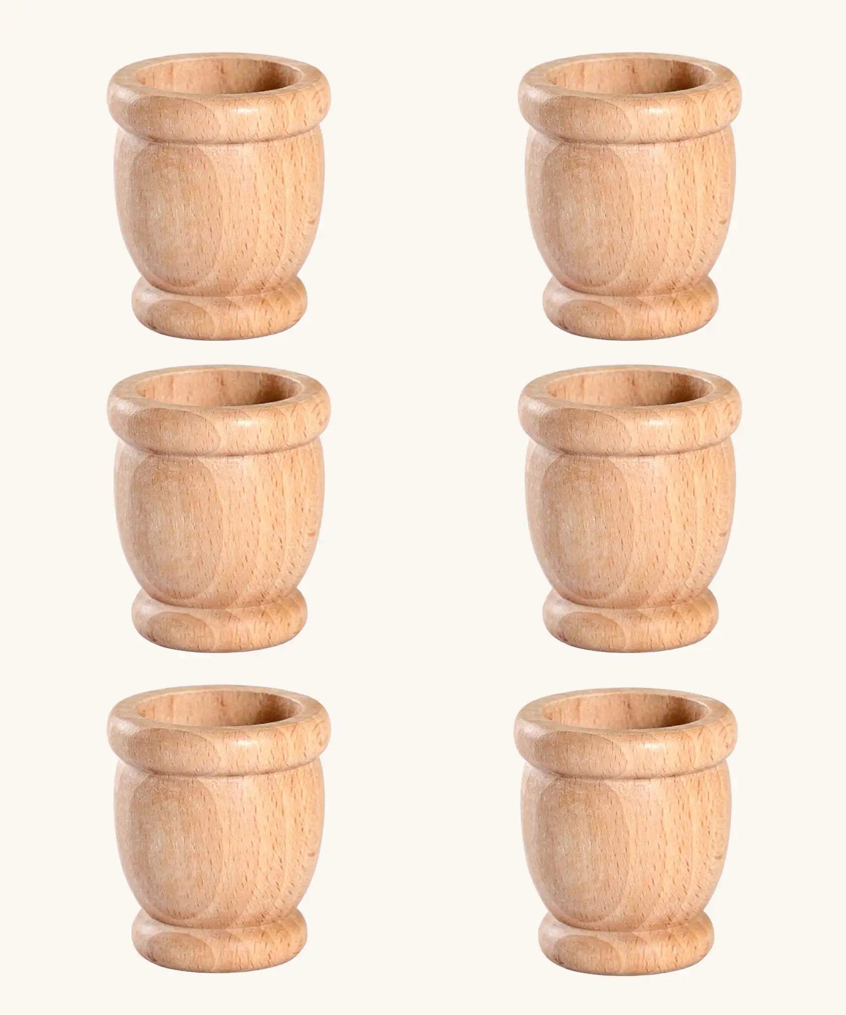 A set of six natural mates loose parts. Wooden cups to acomany other Grapat wooden loose parts and Nin peg dolls.