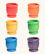 A set of six rainbow mates wooden loose parts. Red, orange, yellow, green, blue and purple. 