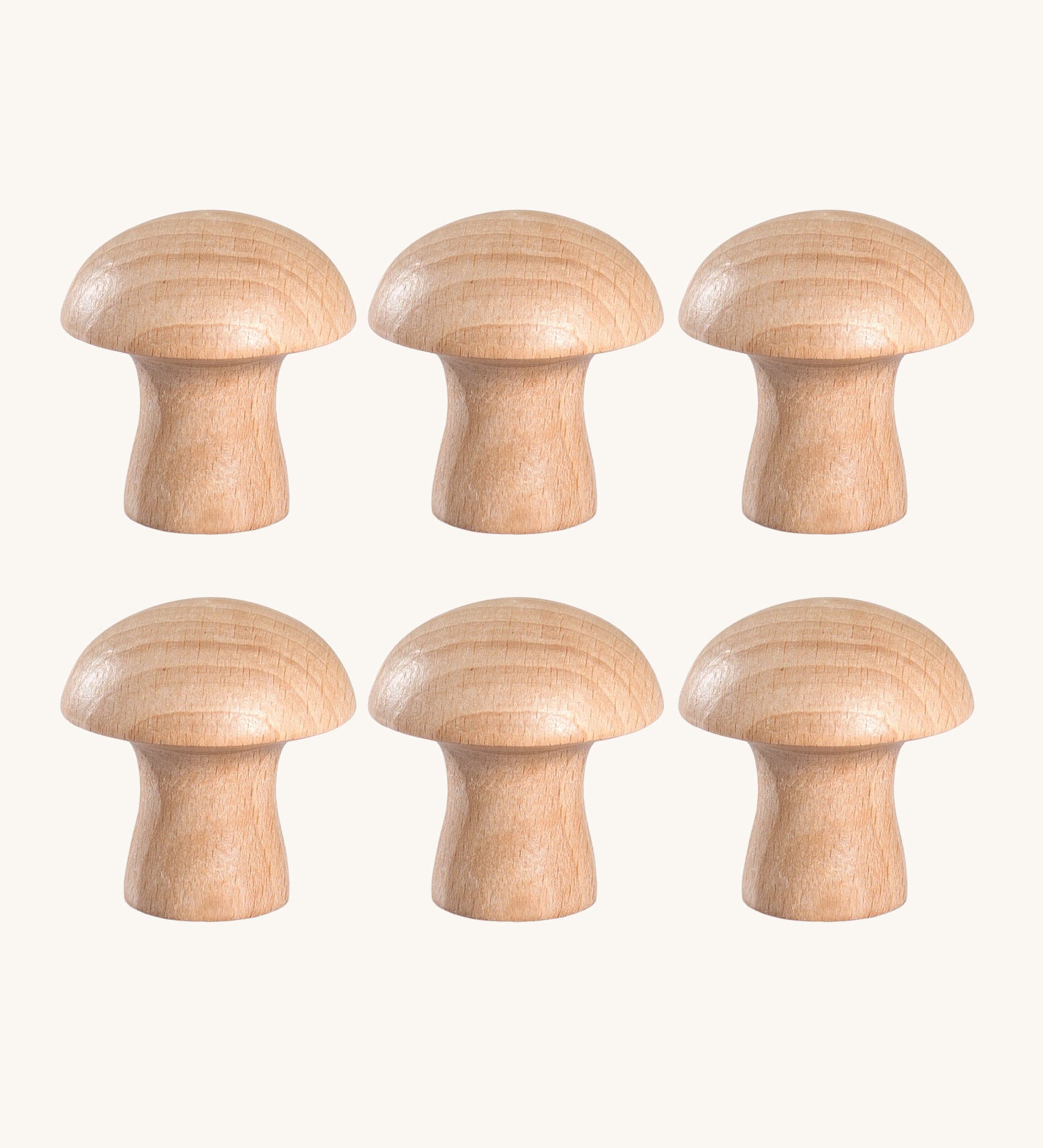 A set of 6 Grapat natural wooden mushroom loose parts. These wooden toys are part of a wide range of open ended toys available at Babipur.