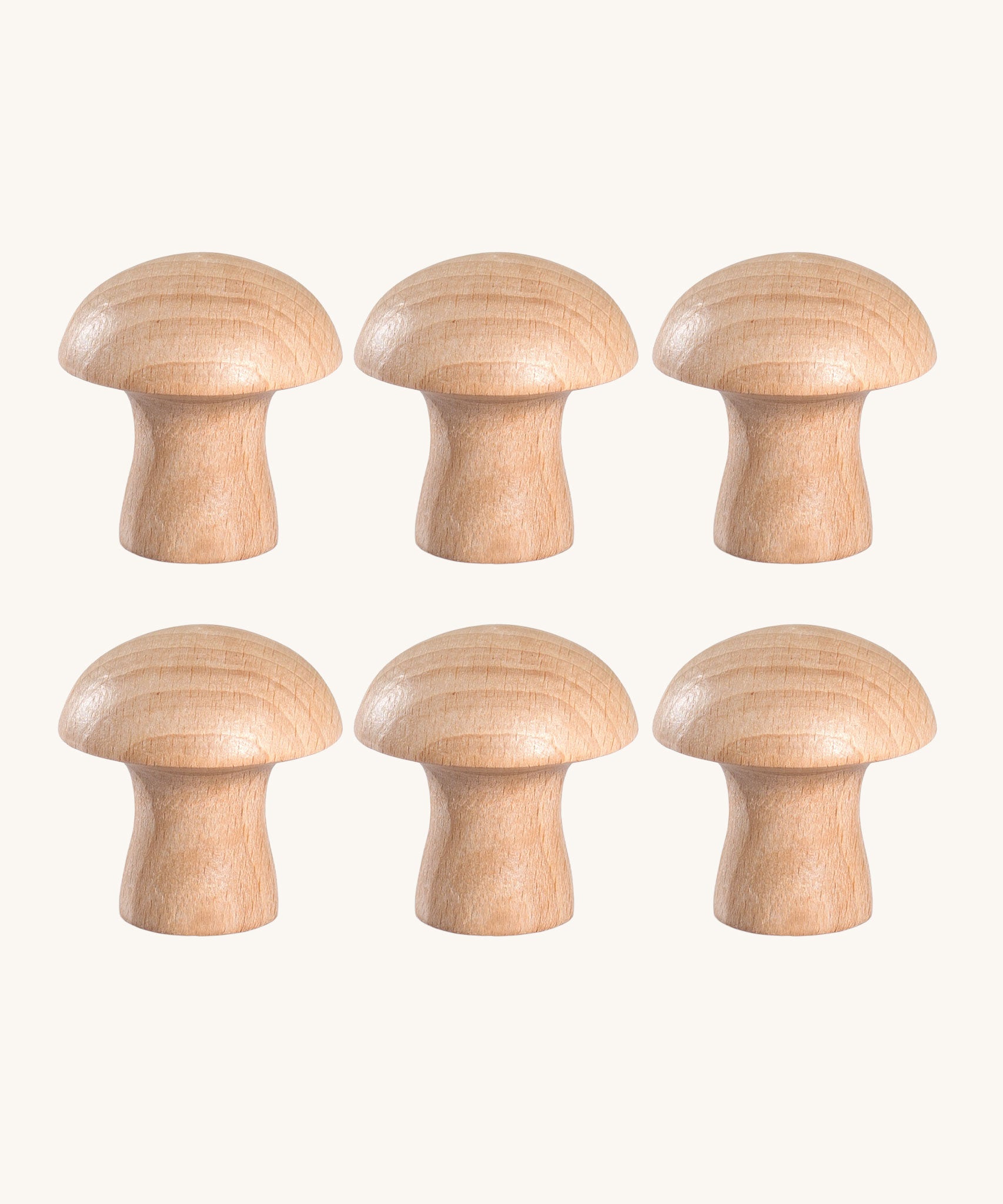 A set of 6 Grapat natural wooden mushroom loose parts. These wooden toys are part of a wide range of open ended toys available at Babipur.