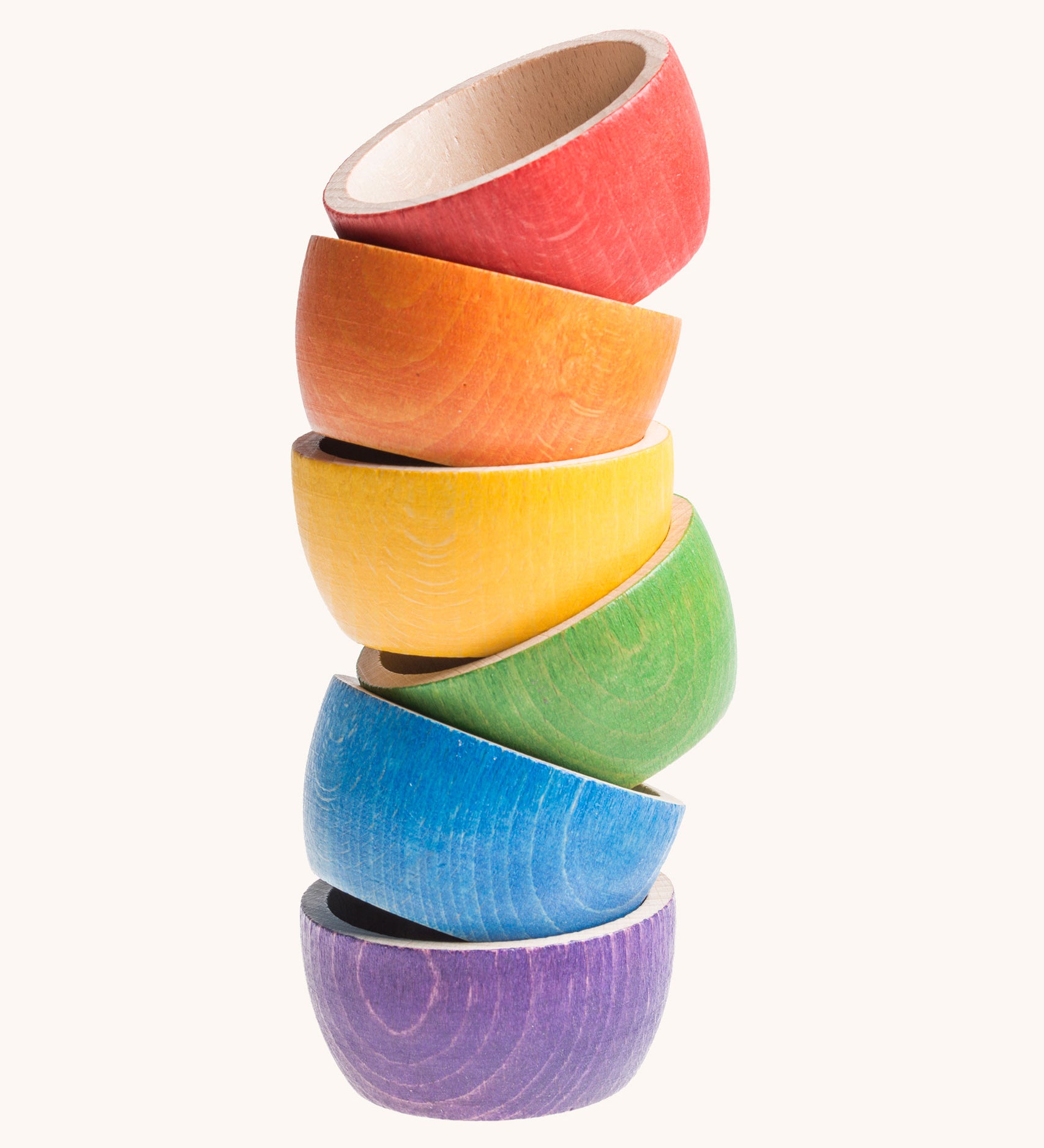 Grapat 6 Rainbow Sorting Bowls stacked up. These wooden bowls are part of a wide range of loose parts and wooden toys available here at Babipur. 