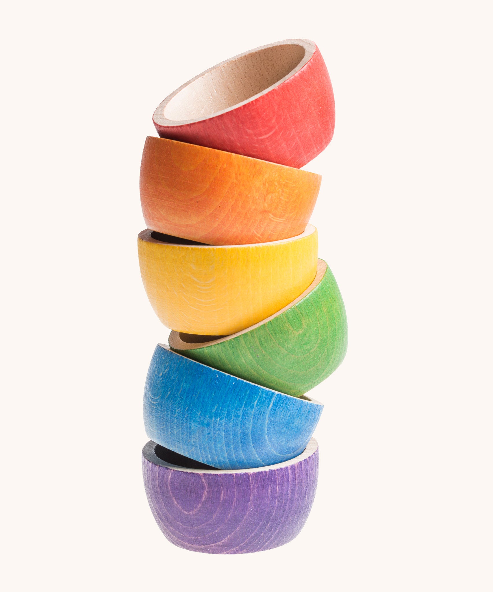 Grapat 6 Rainbow Sorting Bowls stacked up. These wooden bowls are part of a wide range of loose parts and wooden toys available here at Babipur. 