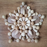A mandala pattern made from Grapat natural wooden loose pieces