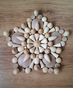 A mandala pattern made from Grapat natural wooden loose pieces