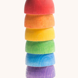 Grapat 6 Rainbow Sorting Bowls stacked up upside down. These wooden bowls are part of a wide range of loose parts and wooden toys available here at Babipur. 