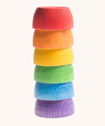 Grapat 6 Rainbow Sorting Bowls stacked up upside down. These wooden bowls are part of a wide range of loose parts and wooden toys available here at Babipur. 