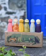 Grapat animal crew peg doll Nins placed on the illustrated cardboard box packaging. 
