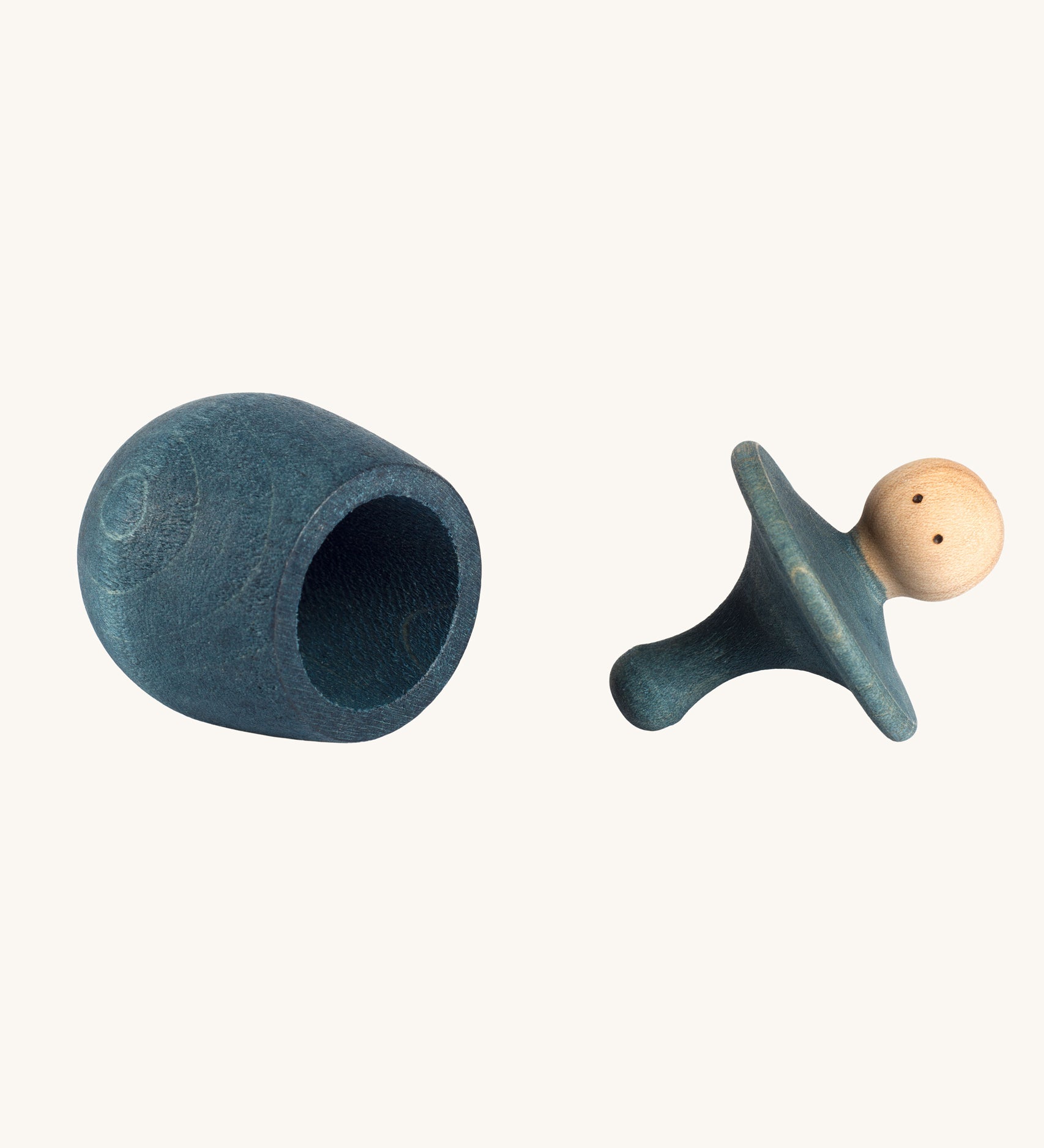 Grapat blue Little Things. A wooden top with eyes drawn on and a blue coloured pot to match. Grapat have a wide range of wooden toys and loose parts available at Babipur. 