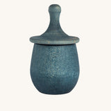 Grapat blue Little Things. A wooden top with eyes drawn on and a blue coloured pot to match. Grapat have a wide range of wooden toys and loose parts available at Babipur. 