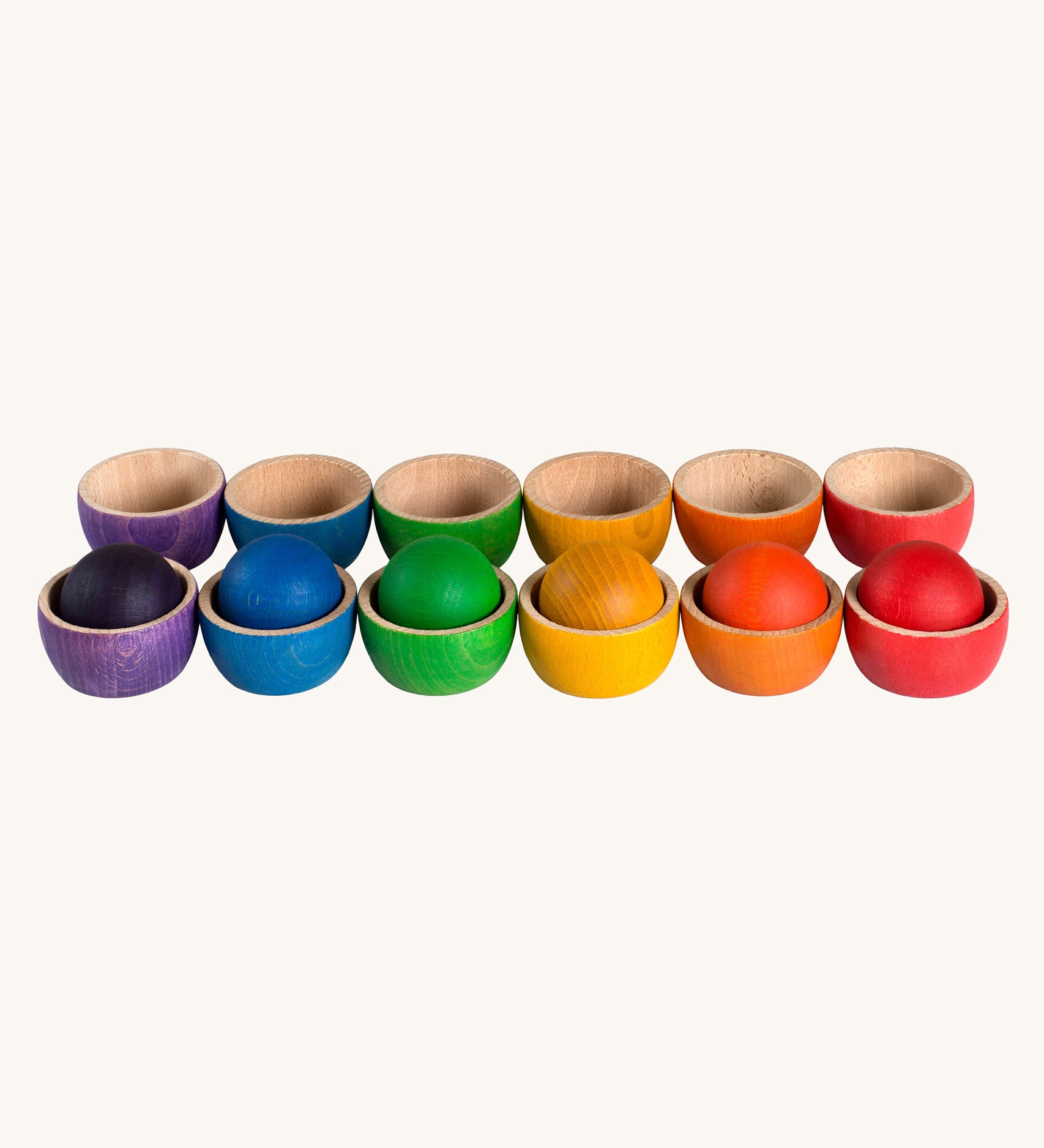 Grapat Bowls & Balls Set. A set of 5 wooden balls and 12 wooden balls. These are perfect for colour matching activities. These wooden toys are part of a wide range of open ended toys available at Babipur.  