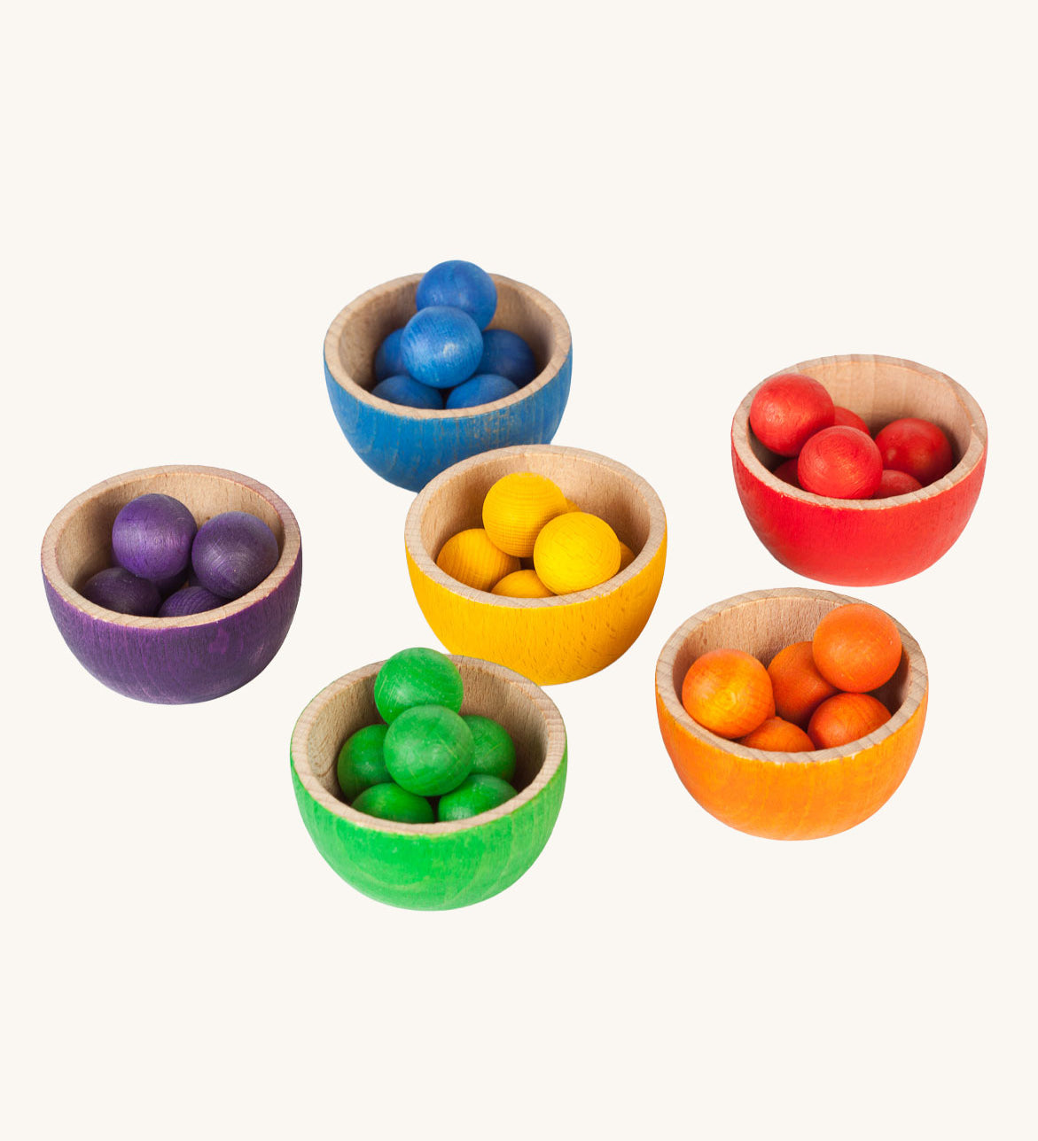 Grapat Wooden Toy Bowls and Marbles Set. A set of 6 coloured bowls with marbles in matching colours. These wooden toys are part of a wide range of open ended toys available at Babipur.  