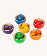 Grapat Wooden Toy Bowls and Marbles Set. A set of 6 coloured bowls with marbles in matching colours. These wooden toys are part of a wide range of open ended toys available at Babipur.  