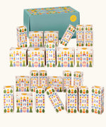 Grapat 2026 advent calendar available at Babipur. A large green box with 24 white patterned boxes filled with various wooden toys, craft kits and gifts. 