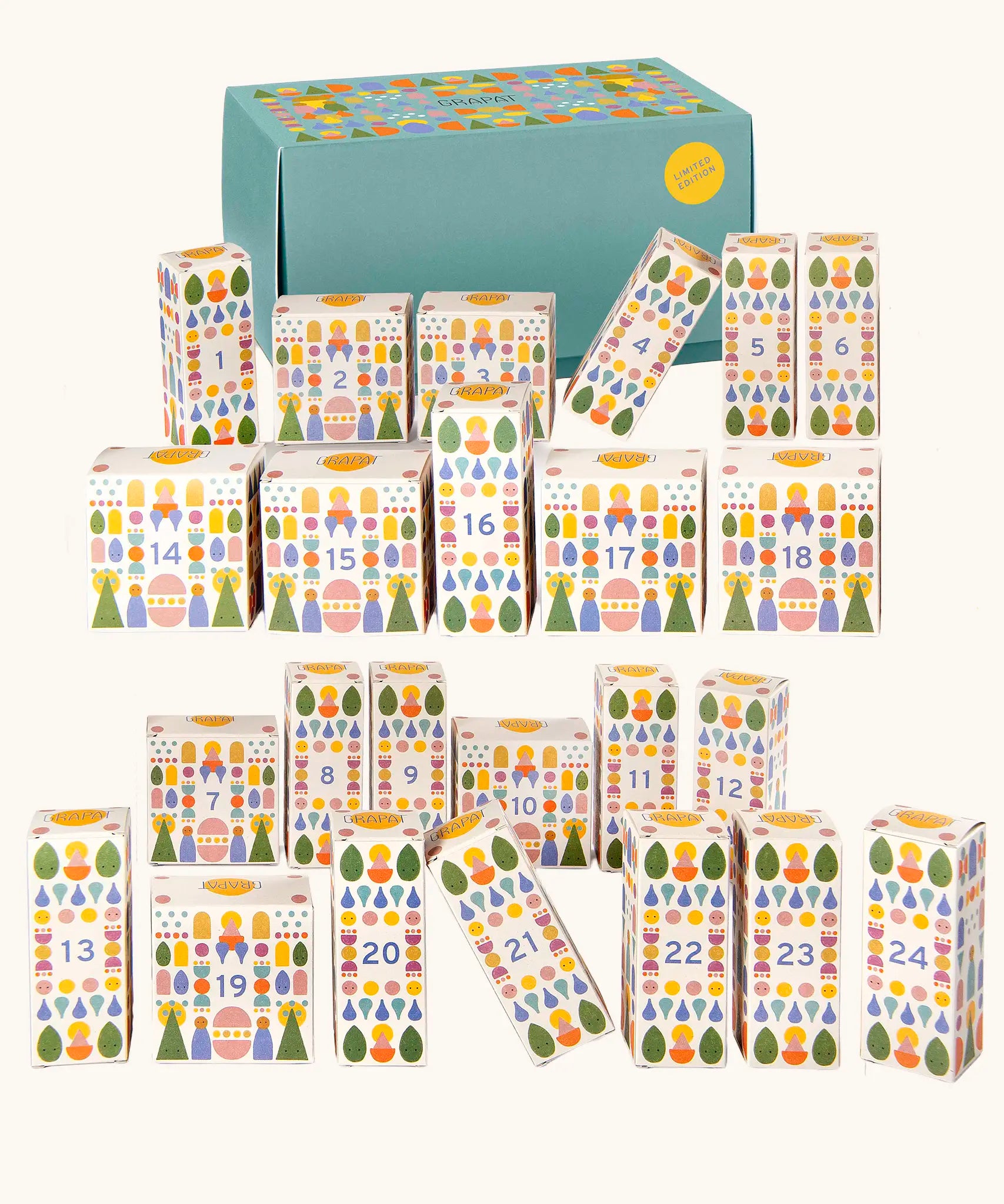 Grapat 2026 advent calendar available at Babipur. A large green box with 24 white patterned boxes filled with various wooden toys, craft kits and gifts. 
