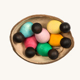 Grapat 6 Dark Baby Nins. A set of 6 small dark wooden baby Nin peg dolls in half a coconut shell. Grapat have a wide range of wooden toys and loose parts available at Babipur. 