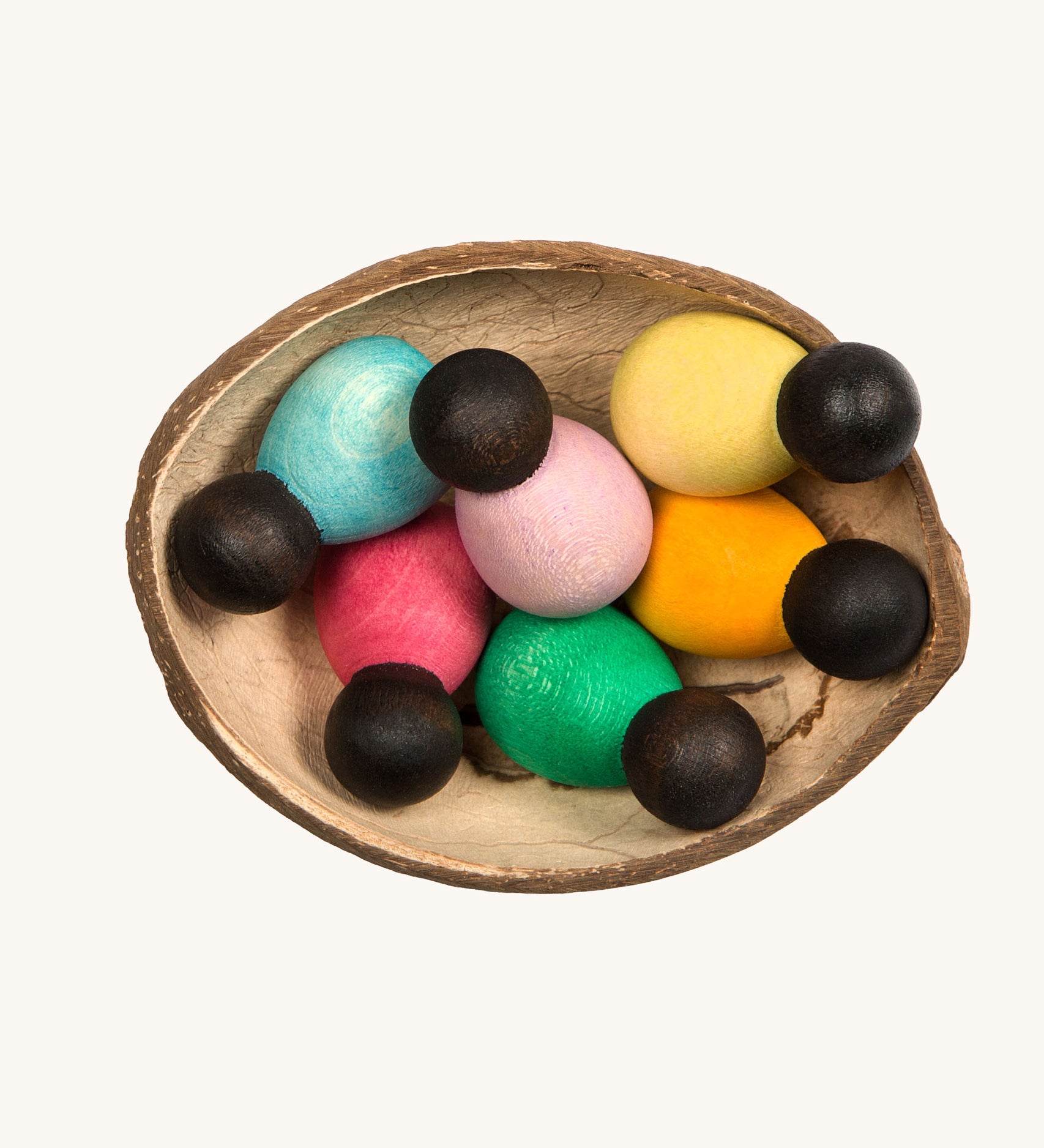 Grapat 6 Dark Baby Nins. A set of 6 small dark wooden baby Nin peg dolls in half a coconut shell. Grapat have a wide range of wooden toys and loose parts available at Babipur. 