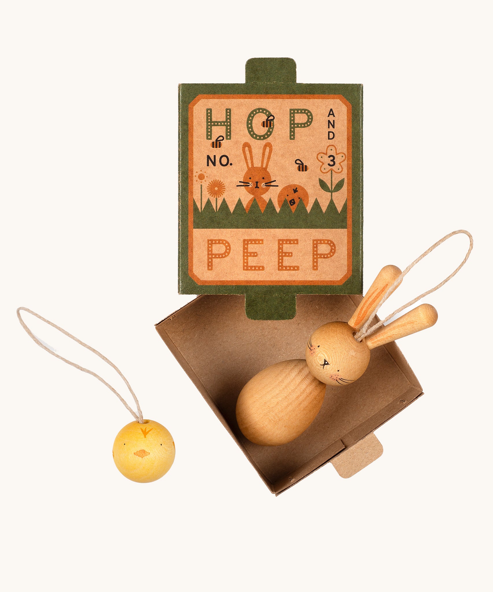 Grapat handmade Wooden Easter Decorations Hop bunny and Peep chick. The decorations are shown with their cardboard packaging box.