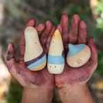 Close up of childs hands covered in paint