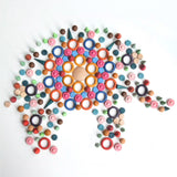 A mandala flatlay shaped as a elephant made from Grapat handcrafted wooden loose pieces