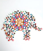 A mandala flatlay shaped as a elephant made from Grapat handcrafted wooden loose pieces