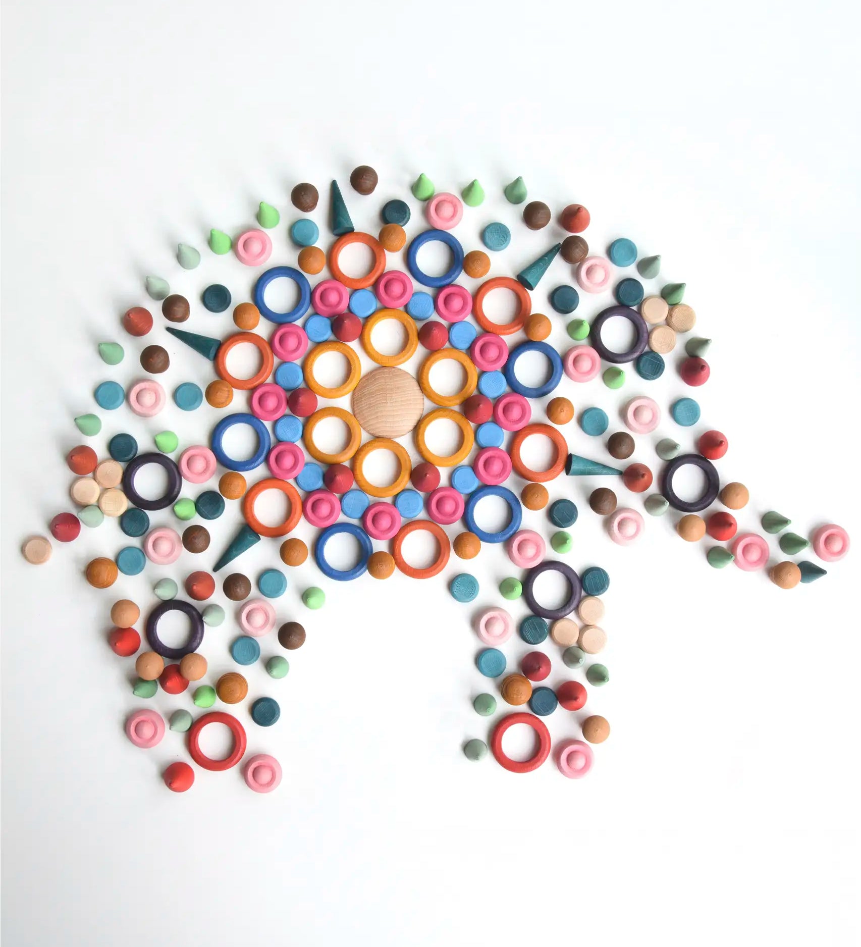 A mandala flatlay shaped as a elephant made from Grapat handcrafted wooden loose pieces