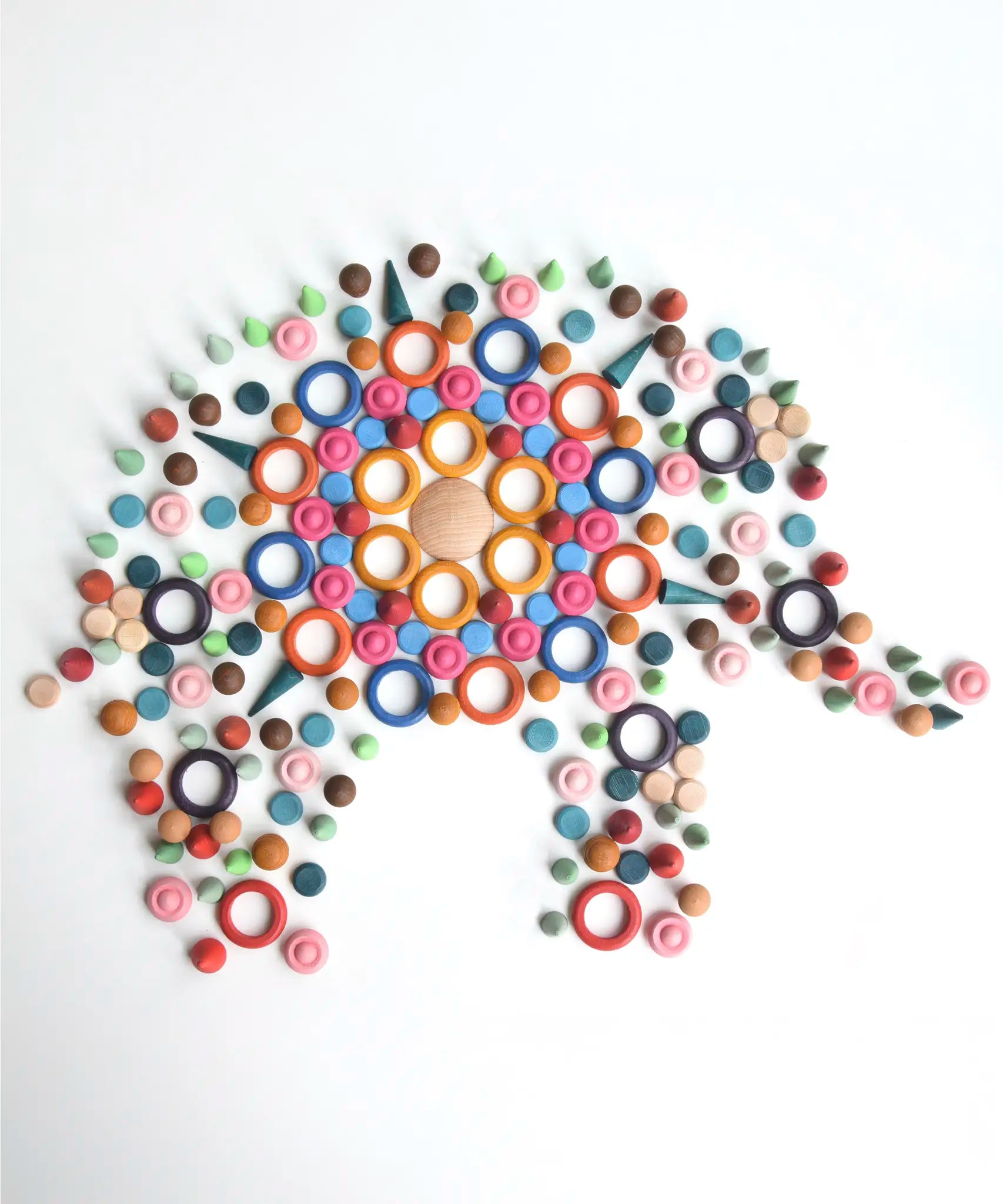 A mandala flatlay shaped as a elephant made from Grapat handcrafted wooden loose pieces