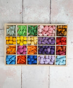 Wooden tinker tray filled with different Grapat mandala pieces in different compartments