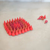 Individual Grapat wooden fire mandala droplet shaped pieces sorted in a diamond shape