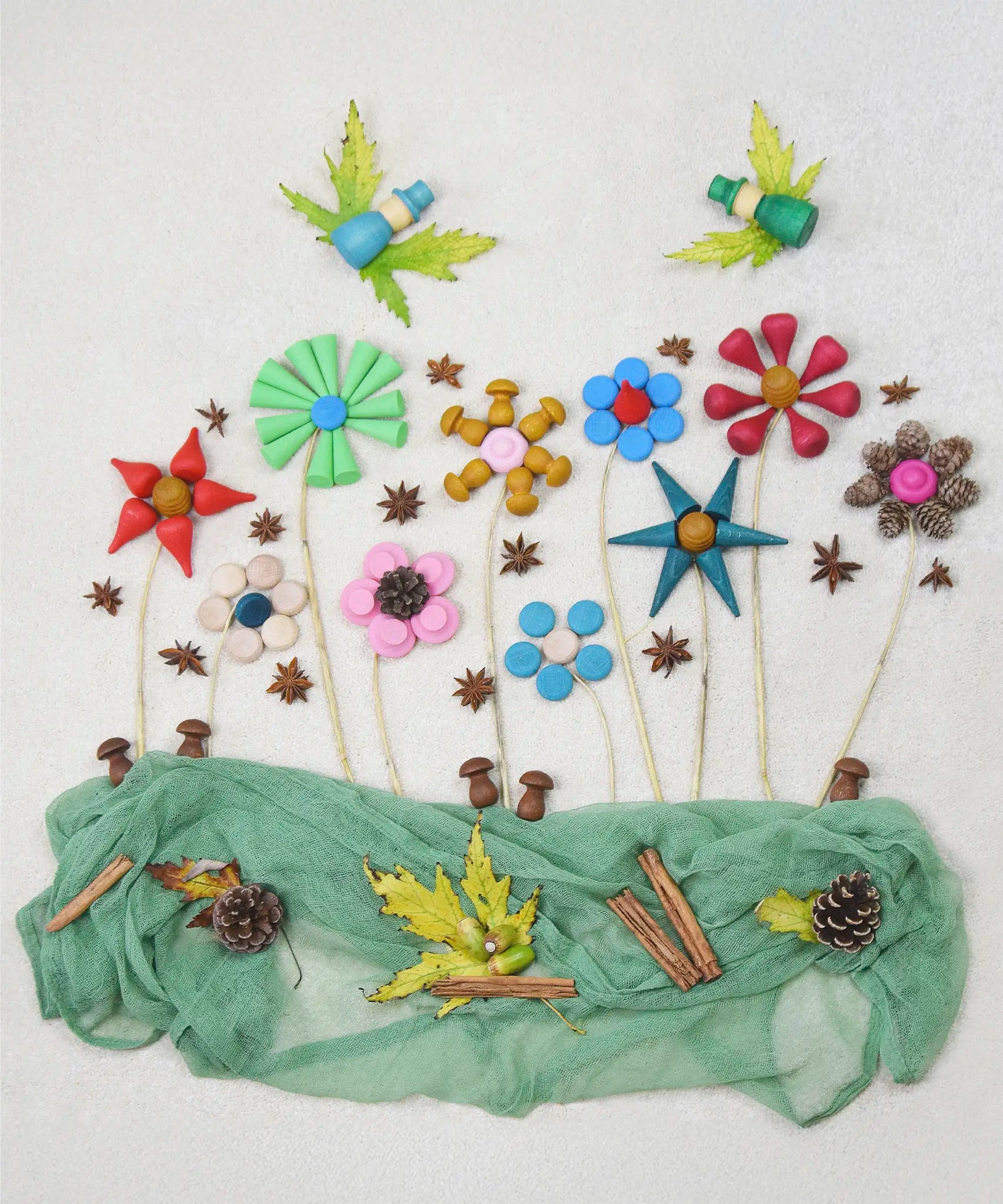 Flatlay of flowers made from Grapat wooden mini mandala pieces