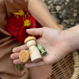 A close up of the flowers inspired woode pieces from the Grapat lucky lucky box showing the delicate painted detail