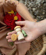 A close up of the flowers inspired woode pieces from the Grapat lucky lucky box showing the delicate painted detail