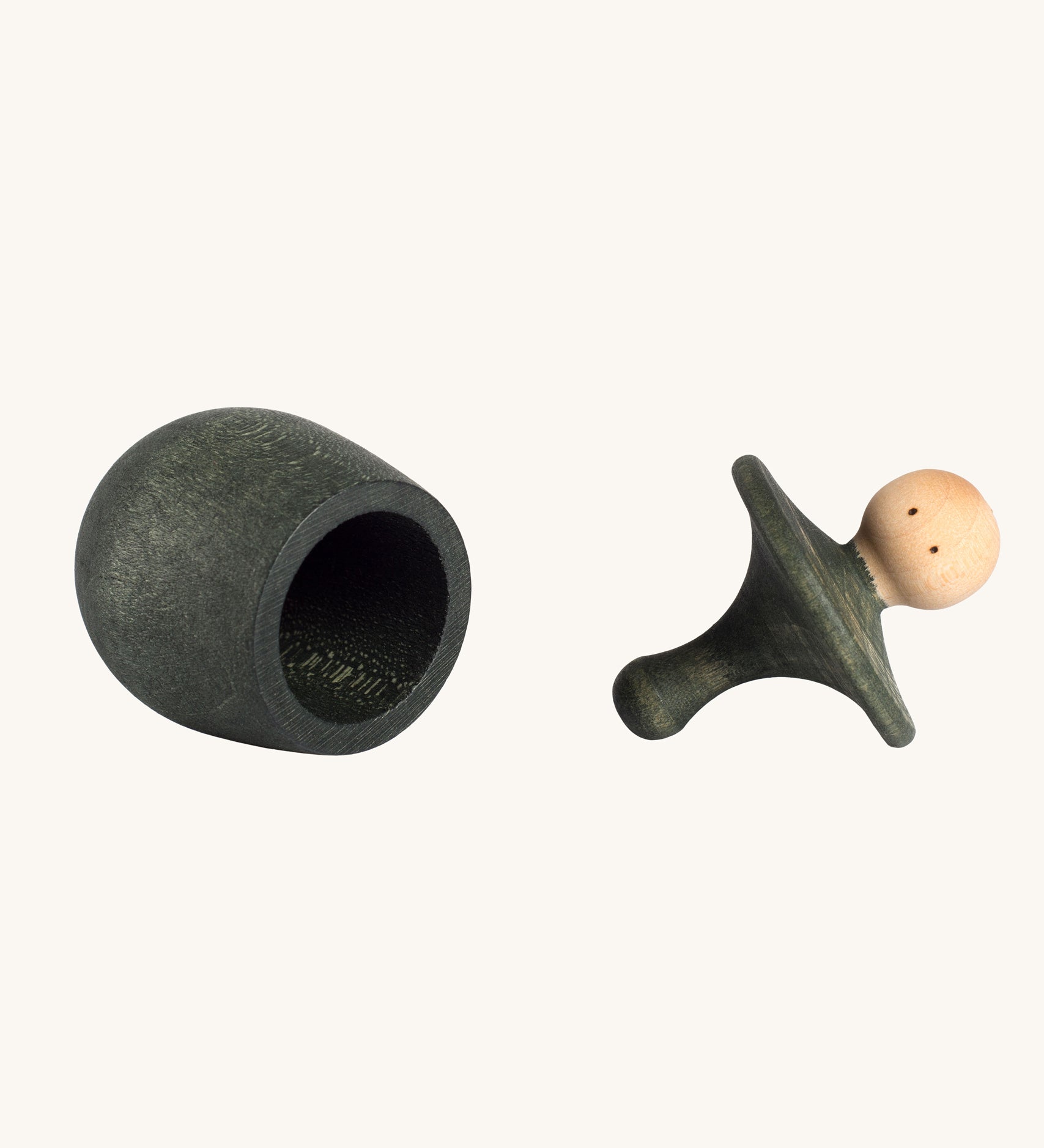 Grapat green Little Things. A wooden top with eyes drawn on and a green coloured pot to match. Grapat have a wide range of wooden toys and loose parts available at Babipur. 