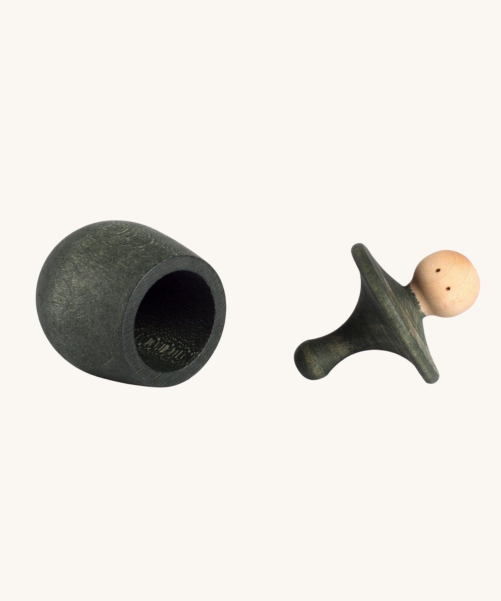 Grapat green Little Things. A wooden top with eyes drawn on and a green coloured pot to match. Grapat have a wide range of wooden toys and loose parts available at Babipur. 
