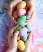 Grapat Happy Eggs wooden toys in children's hands. 