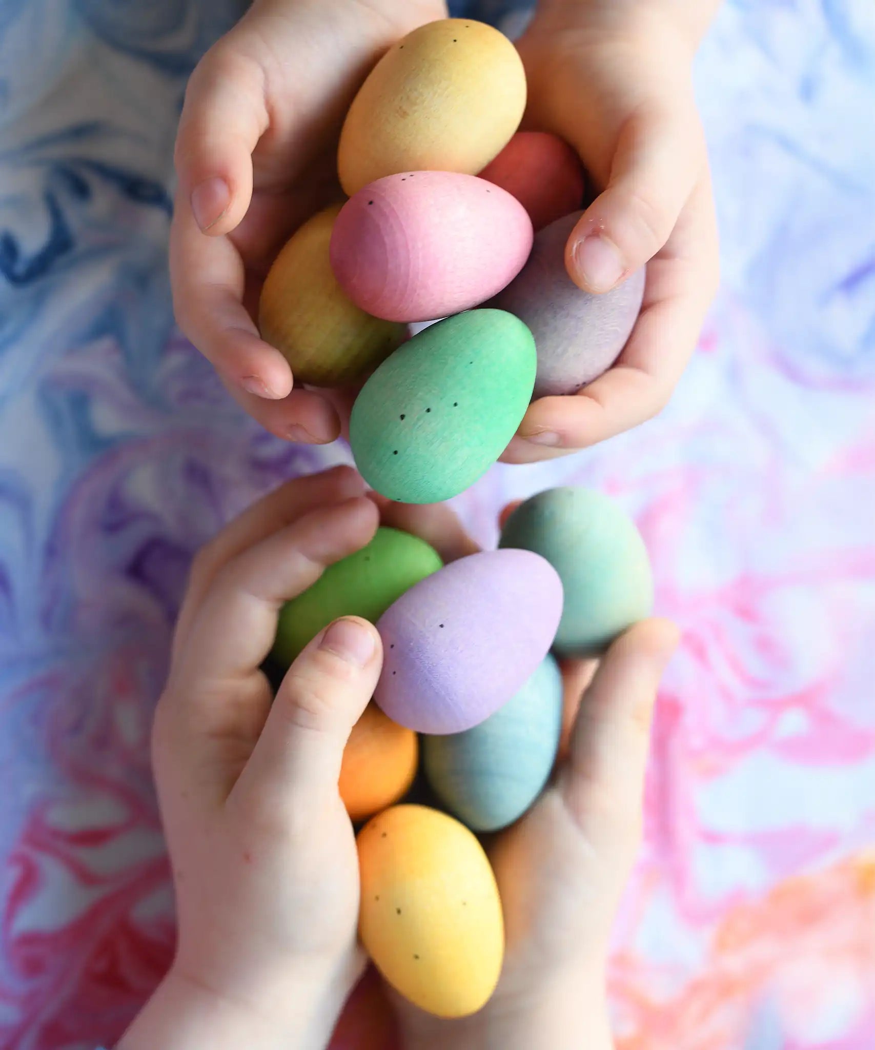 Grapat Happy Eggs wooden toys in children's hands. 